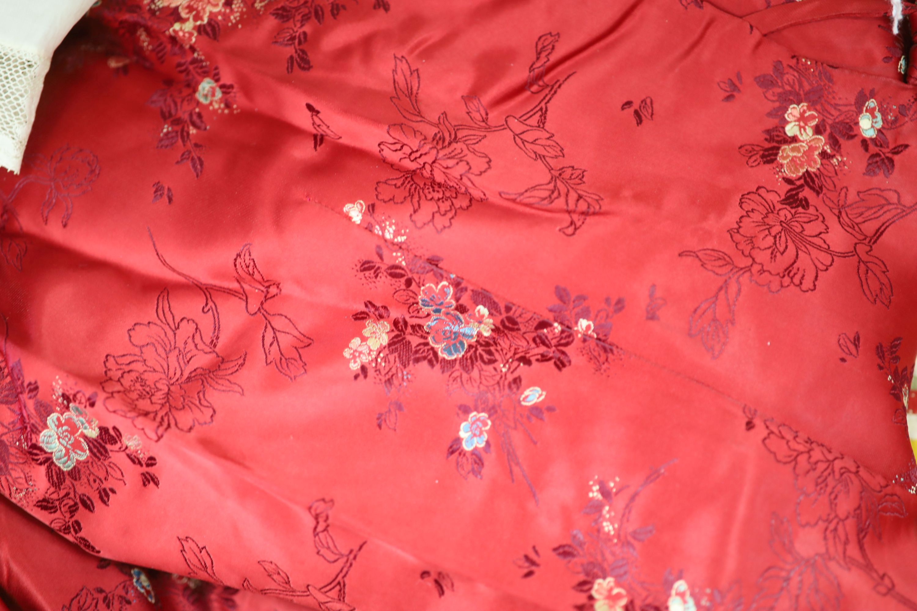 A red brocade dressing gown, embroidered silk runner, Indian panel, Liberty Morris style fabric etc